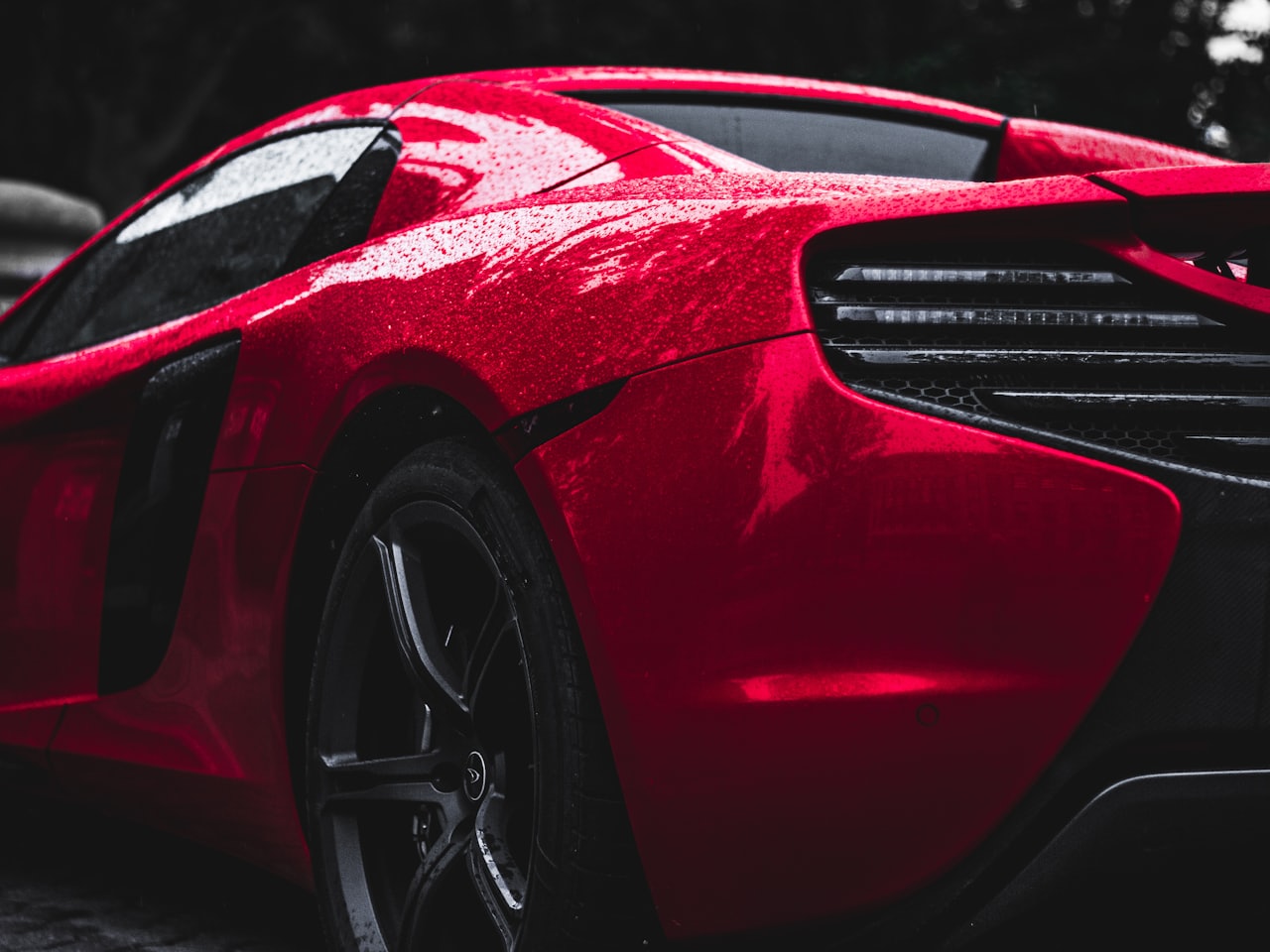 Detailed car paintwork with deep mirror gloss after ceramic coating